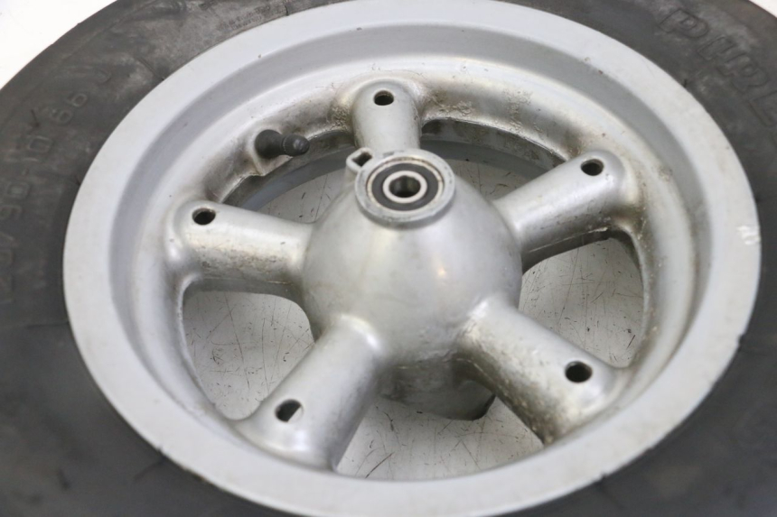 photo de FRONT RIM AND TIRE APRILIA RALLY AC 50 (1995 - 2004) - Zoom on usage condition